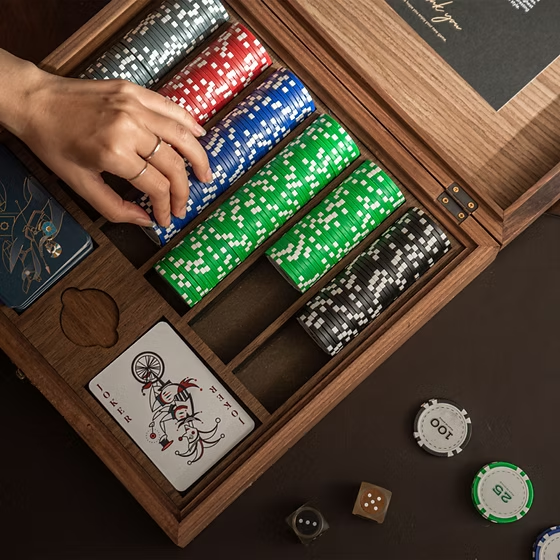 Poker chips and playing cards arranged for a home poker game